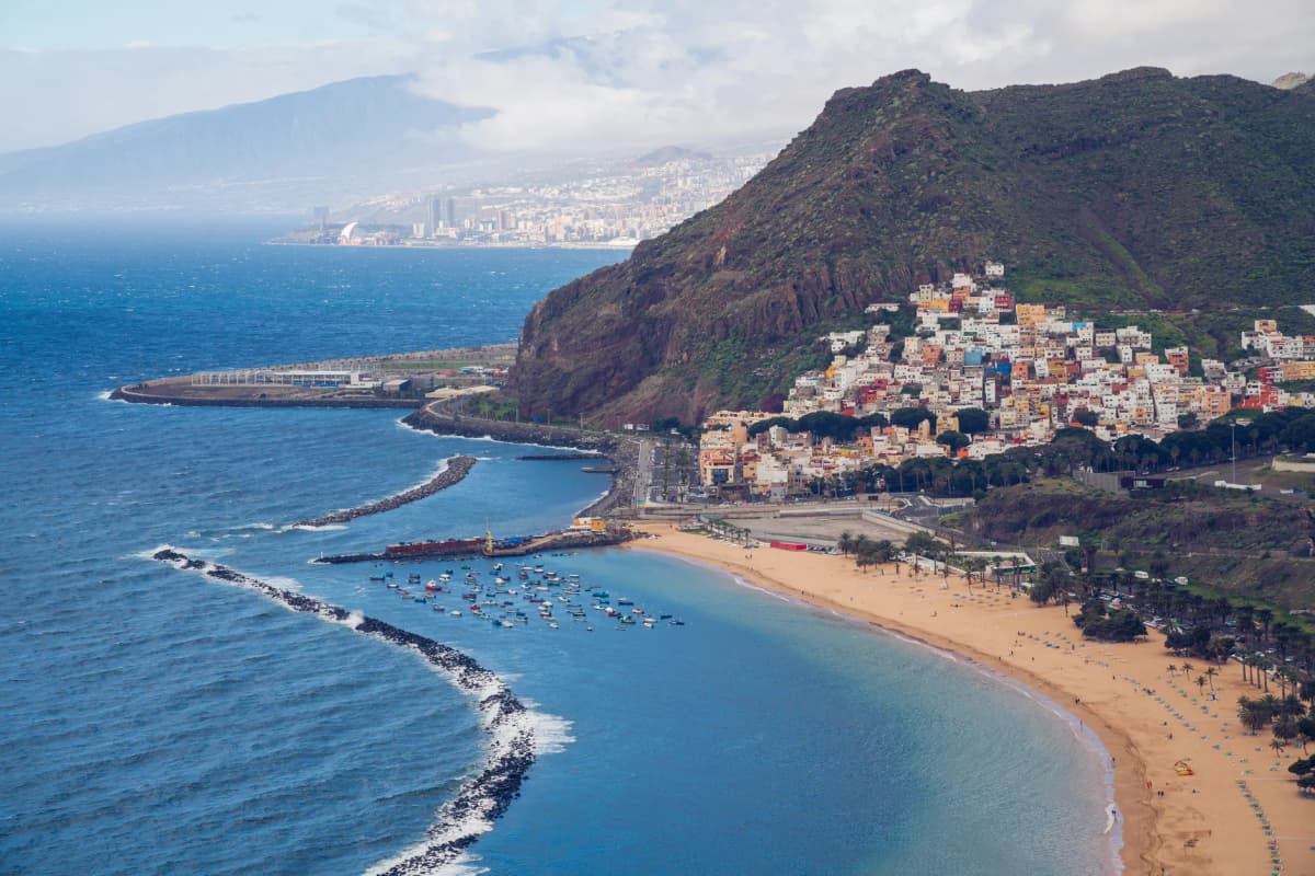 Stunning aerial view of Playa de las Teresitas with mountains and ocean in San Andrés, Tenerife.