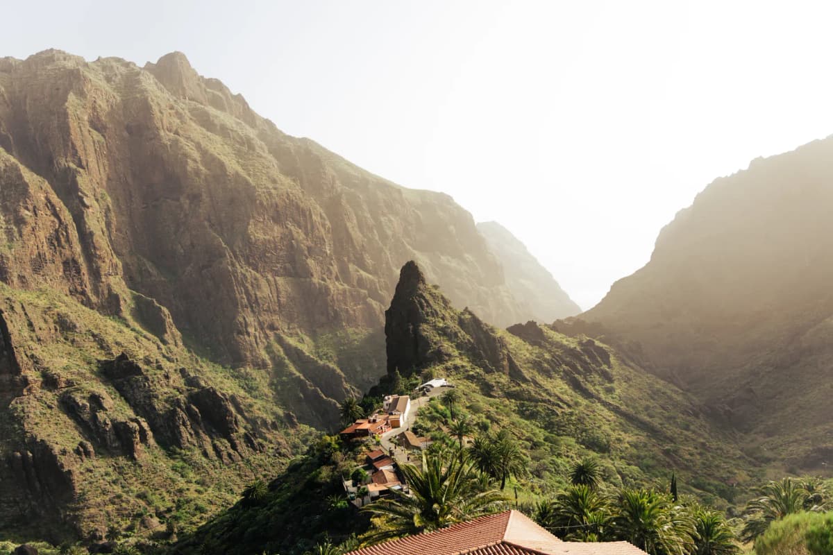 Breathtaking view of Masca village nestled within rocky mountain landscape in Tenerife, Spain.